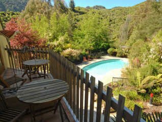 view over pool from deluxe lodge room in charming b&B near nelson nz